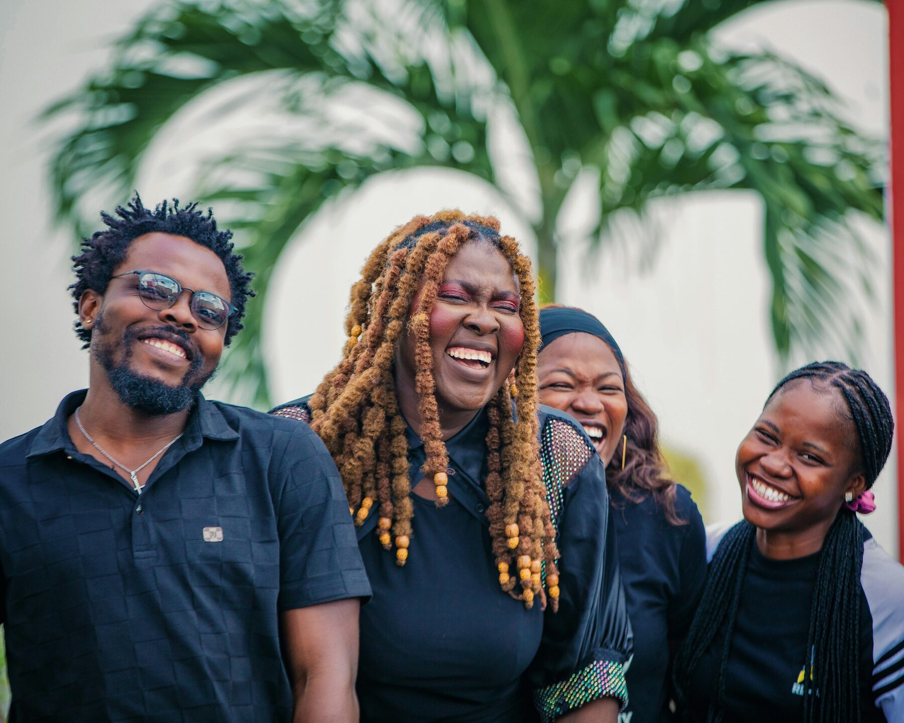 A multi-generational family laughing together at home